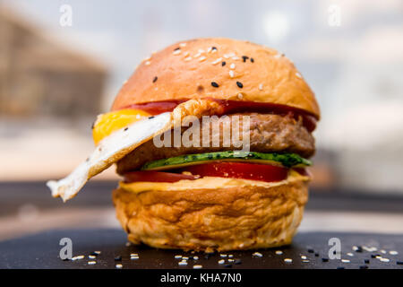 Delicious restaurant hamburger with fried egg Stock Photo