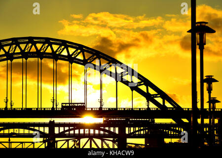 Tyne bridge and High Level detail at sunset with train bus and cars Stock Photo