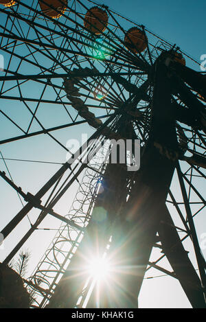 The infamous abandoned ferris wheel in the afternoon autumn light in Pripyat, Ukraine Stock Photo