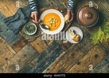 Fall warming pumpkin cream soup, copy space
