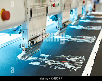 Embroidery industrial machine in sewing workshop Stock Photo