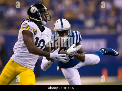 Cleveland Brown running back Jason Wright (29) fumbles the ball after being  tackled by Pittsburgh Steelers corner back Bryant McFadden (20) and  defensive tackle Casey Hampton (98) during the 3rd quarter at