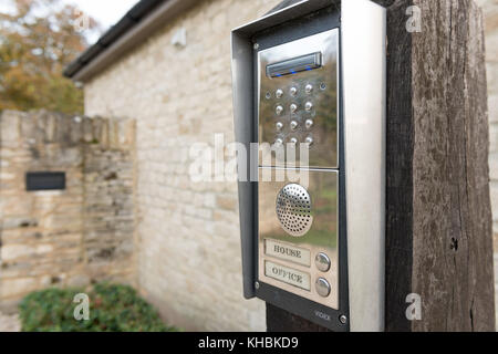 An entry code keypad controlling the entrance to a gated home and office Stock Photo