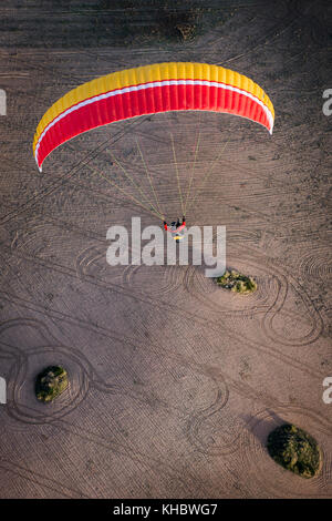 Paraglider over ploughed field, near Algodonales, Andalusia, Spain Stock Photo