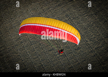 Paraglider over ploughed field, near Algodonales, Andalusia, Spain Stock Photo