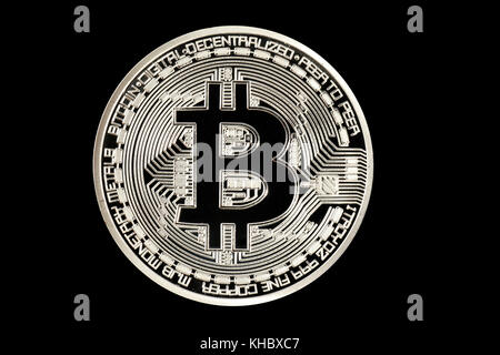 Symbol image digital currency, silver physical coin Bitcoin Stock Photo