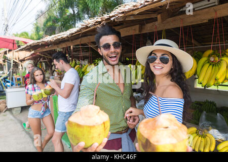 Couple Drink Coconut Cocktail On Street Traditional Fruits Market Stock Photo