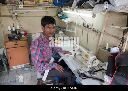 Tailor working at his sewing machine in Mumbai, India Stock Photo