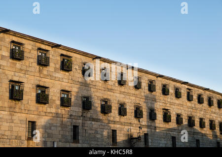 Convent located next to the cathedral of Santiago de Compostela (Galicia, Spain). The windows with bars show that it is a convent of cloister. Stock Photo