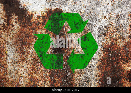 Grunge Recycle sign on rusty metal background texture Stock Photo