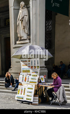 Florence, Italy - October 31st, 2017: A watercolour painter, outside the Uffizi Galleries in Florence, Tuscany, Italy Stock Photo