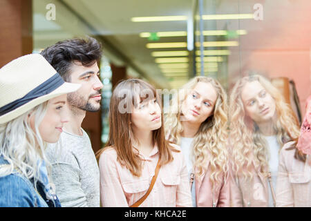 Group of friends shopping together in a shopping mall Stock Photo