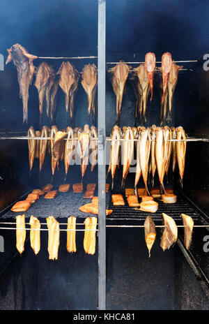 Smoked fish hanging in a smokehouse Stock Photo - Alamy
