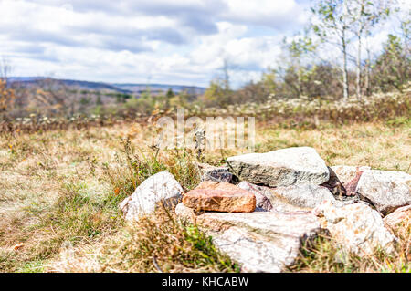 Closeup of fire pit on backpacking campsite made of rocks and stones in meadow field in Dolly Sods, West Virginia Stock Photo