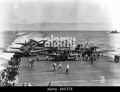 U.S. Navy Torpedo Squadron Six (VT-6) TBD-1 aircraft are prepared for launching on USS Enterprise (CV-6) at about 0730-0740 hrs, 4 June 1942. Eleven of the fourteen TBDs launched from Enterprise are visible. Three more TBDs and ten F4F fighters must still be pushed into position before launching can begin. Battle of Midway Stock Photo
