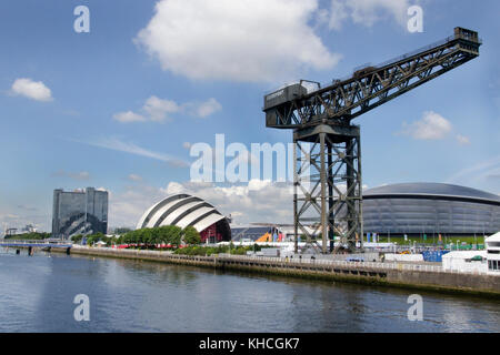 GLASGOW, SCOTLAND- JULY 28 2014: A side view of the Finnieston crane, SEC Armadillo and the Crowne Plaza Glasgow hotel on the River Clyde Stock Photo