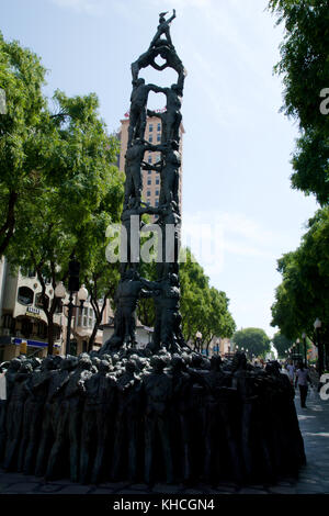 TARRAGONA, SPAIN - AUG 28th, 2017: statue of people making human towers, a traditional spectacle in Catalonia called castellers, with people climbing and making high structures Stock Photo