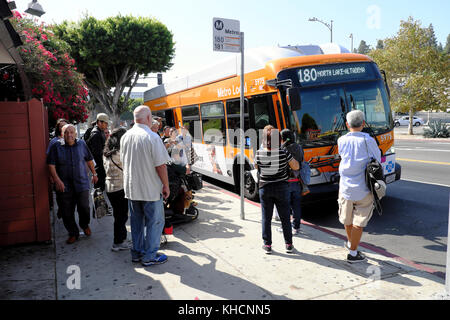 People passengers waiting at a bus stop on Vermont Avenue in Los Feliz area city of Los Angeles LA California USA US  KATHY DEWITT Stock Photo