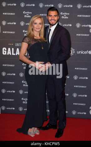 Sergio Romero his wife Eliana Guercio attend a gala dinner at Old Trafford in Manchester, held by Manchester United and Unicef to raise funds for the charity. Stock Photo