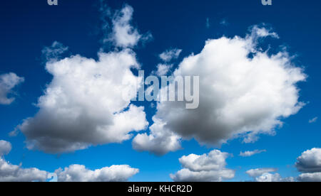 white clouds over deep blue sky background Stock Photo