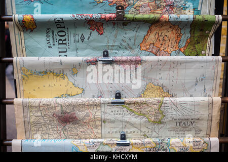 Vintage rolled geographic maps in Spitalfield Market (London). Travel concept. Landscape format. Stock Photo