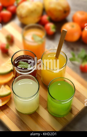 assorted fruit juices with ingredients around - closeup Stock Photo