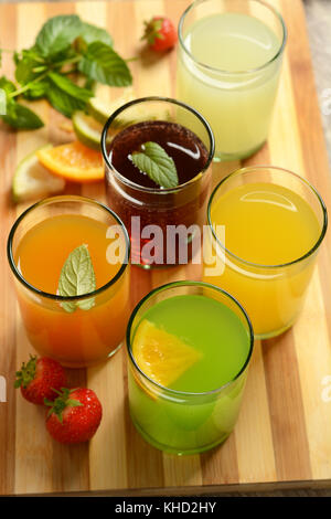 assorted fruit juices with ingredients around - closeup Stock Photo