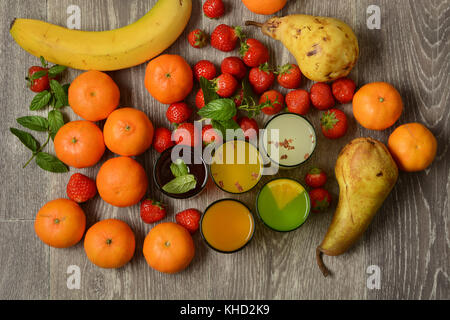 assorted fruit juices with ingredients around - closeup Stock Photo