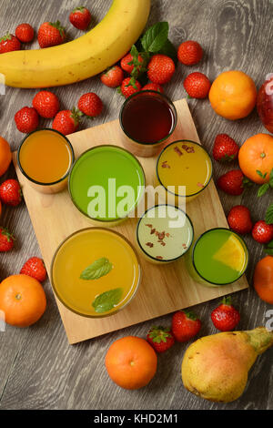 assorted fruit juices with ingredients around - closeup Stock Photo