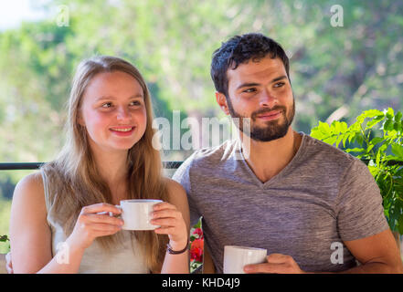 Young couple enjoying coffee on the terrace Stock Photo