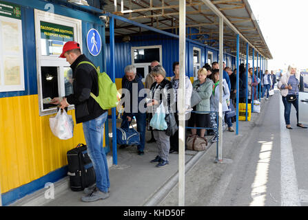 Travelers standing in line for passport control procedure at the border crossing point Kalanchak. September 20, 2017. Khersonskaya oblast, Ukraine Stock Photo