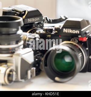Nikon FE, Nikon FE and Nikon F3 single lens reflex 35mm professional film camera's, Nikon is Japanese company and was founded 1917. Stock Photo