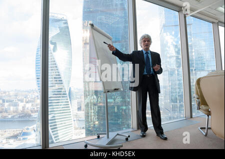 Mature business man making a presentation Stock Photo