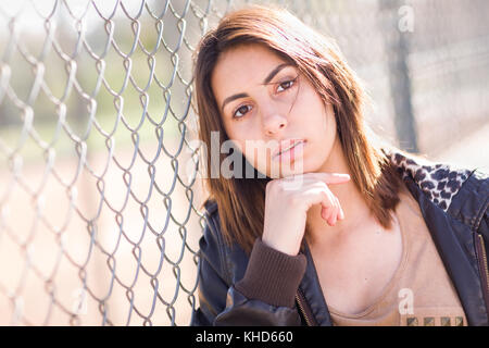 Beautiful Meloncholy Mixed Race Young Woman Portrait Outside. Stock Photo
