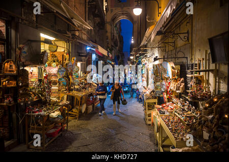 NAPLES, ITALY - OCTOBER 16, 2017: Night time view of the famous 'Christmas Alley' (Via San Gregorio Armeno) home to the Neapolitan Presepi (Nativity s Stock Photo