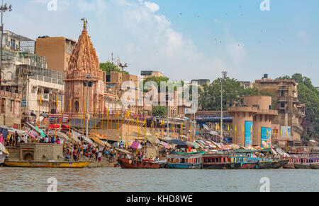 Historic Varanasi city with ancient architectural buildings and temples along the Ganges river ghat. Stock Photo