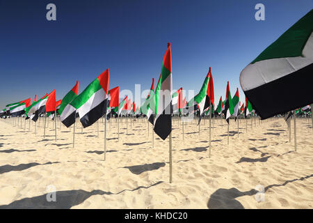 Flags of UAE on beach on UAE flag day close-up Stock Photo