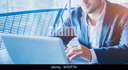 people using computer, business man working online on laptop, technology background Stock Photo