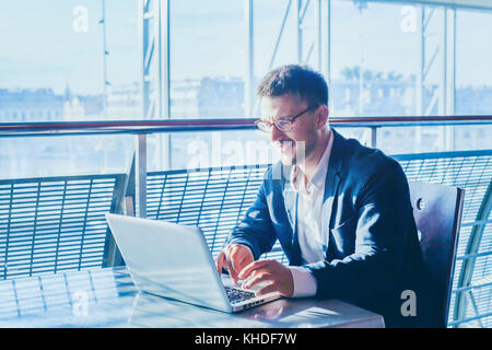 business man entrepreneur working on computer, businessman reading emails and smiling Stock Photo