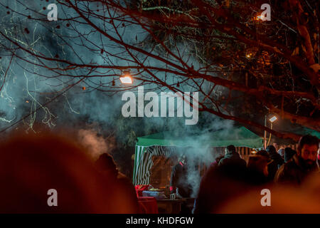 PERNIK, BULGARIA - JANUARY 27, 2017: Part of the crowd is waiting in line to buy freshly prepared food outdoors at Surva, the International Festival o Stock Photo