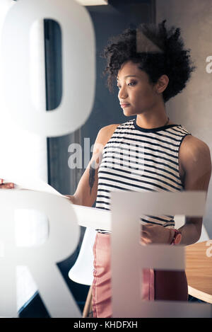 Businesswoman reviewing document Stock Photo