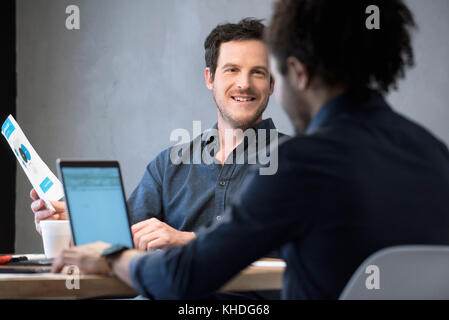 Colleagues collaborating on project Stock Photo