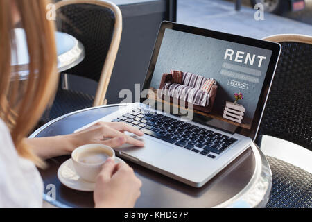 rent online concept, woman using internet website for rental apartments, houses and flats Stock Photo