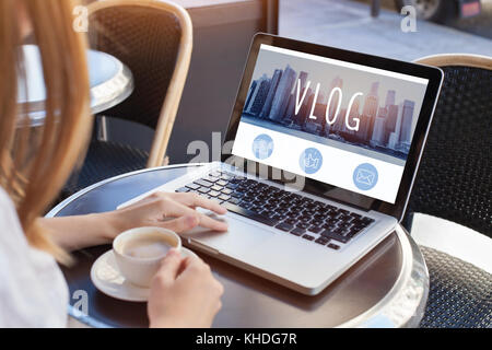video blog, woman reading vlog online on computer Stock Photo