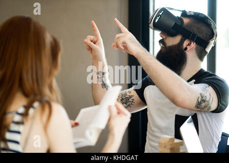 Man using virtual reality simulator Stock Photo