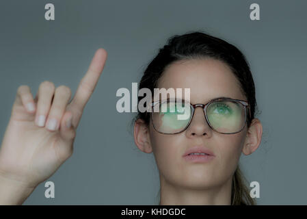Young woman using touch screen technology Stock Photo