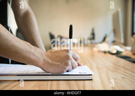 Man writing Stock Photo