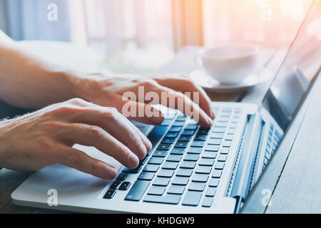 close up of hands of business person working on computer, man using internet and social media Stock Photo