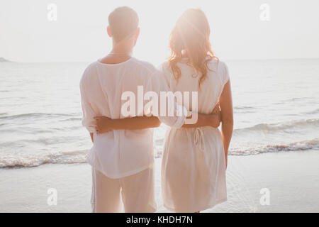 affectionate couple on the beach, honeymoon travel Stock Photo