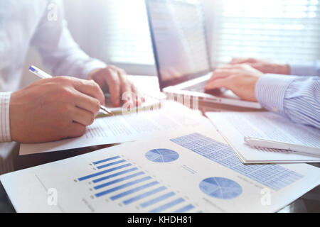 business team working with charts in the office Stock Photo